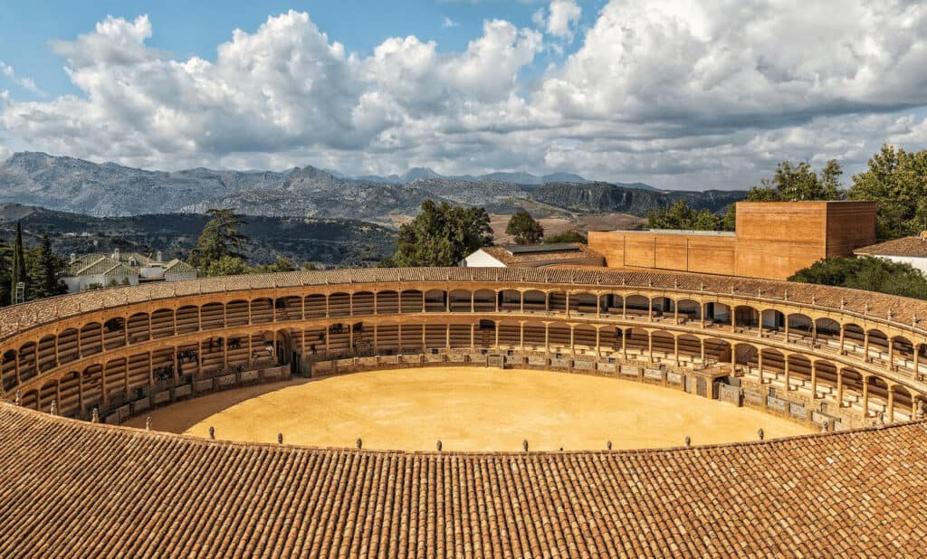 Bullring of Ronda, a historic landmark with stunning mountain scenery in the background.