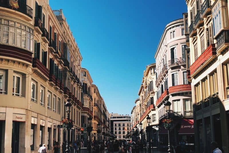 Beautiful street scene in Malaga with historic architecture and vibrant city life.