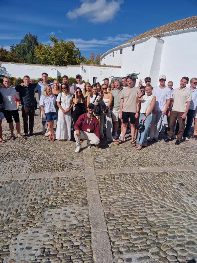 Happy team enjoying a company retreat in Costa del Sol, perfect for team building and corporate even.