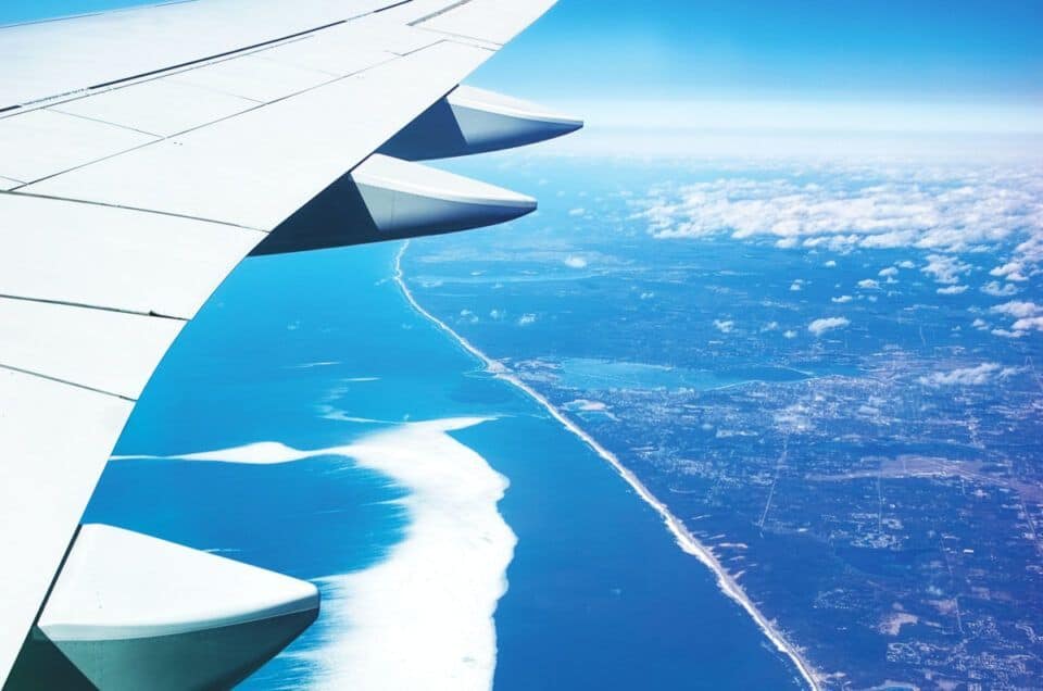 Airplane wing view over the Atlantic Ocean heading to Spain.