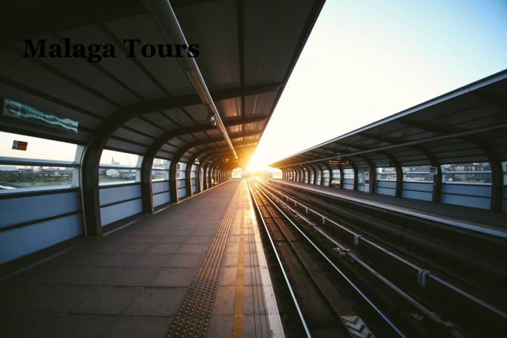 Modern train station platform at sunset in Malaga, Spain.
