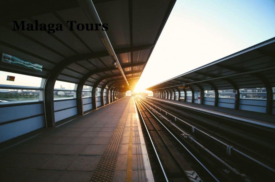 Modern train station platform at sunset in Malaga, Spain.