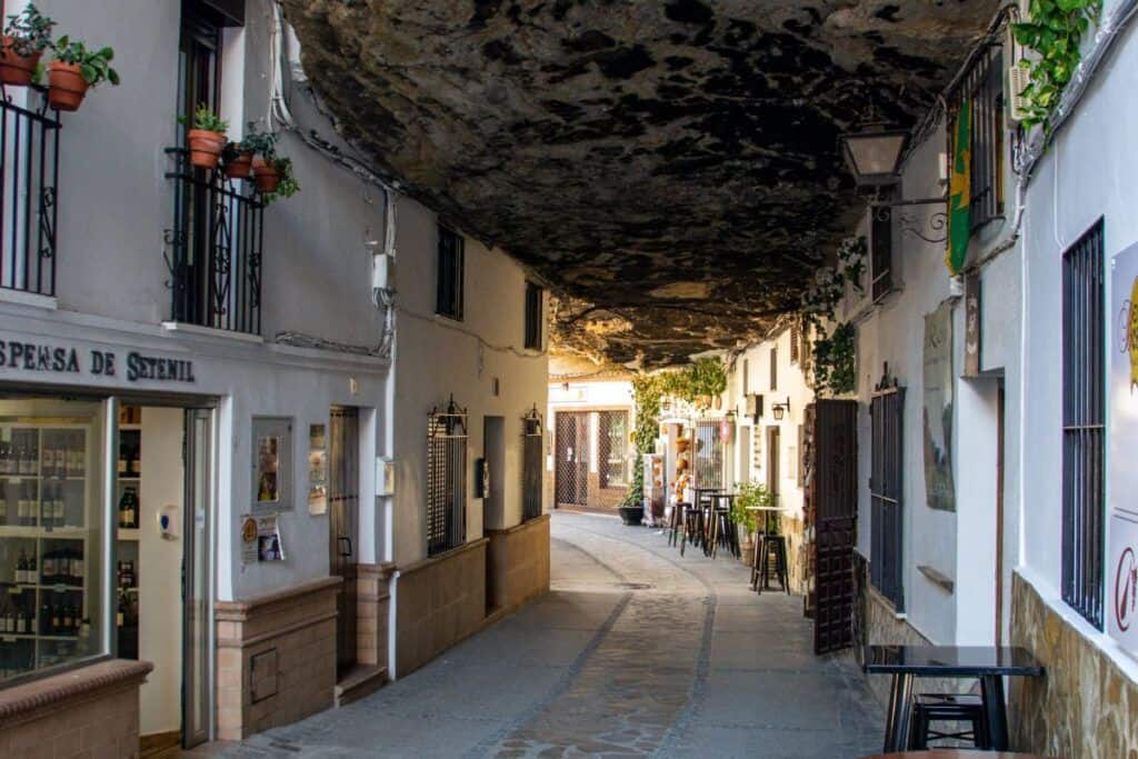 Rock-Covered Street in Setenil de las Bodegas, Andalusia, built into natural rock formations.