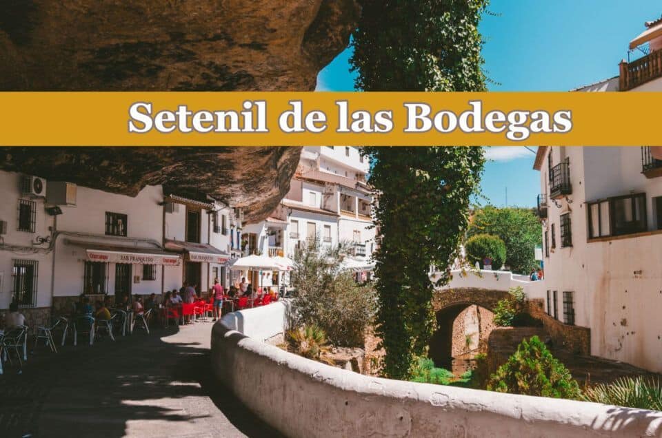 Historic village built into rocky cliffs in Andalusia.