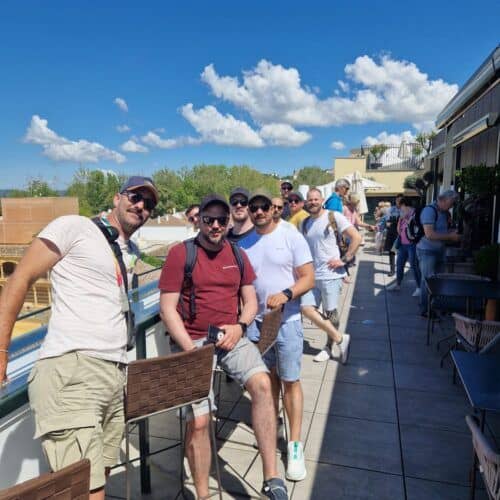 Group of tourists enjoying a boat tour with Costa Excursions on a sunny day.