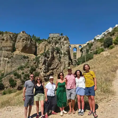 Group of tourists visiting a historic site with scenic views in Costa del Sol.