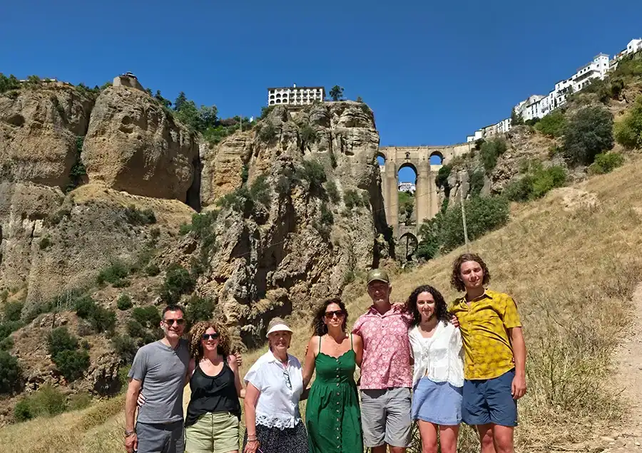 Group of tourists visiting a historic site with scenic views in Costa del Sol.