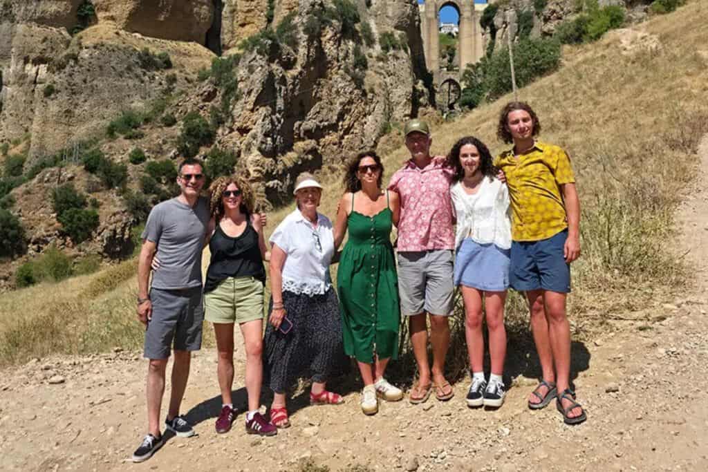 Exploring scenic Costa excursions with a group of travelers at historic ruins.